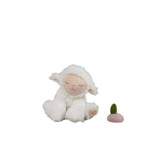 White plush lamb toy with a small green and pink object on a white background