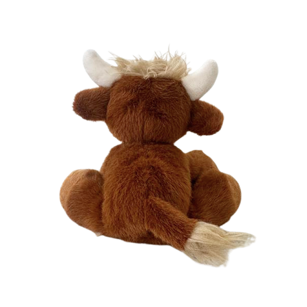 Plush toy of a brown yak with white horns on a white background