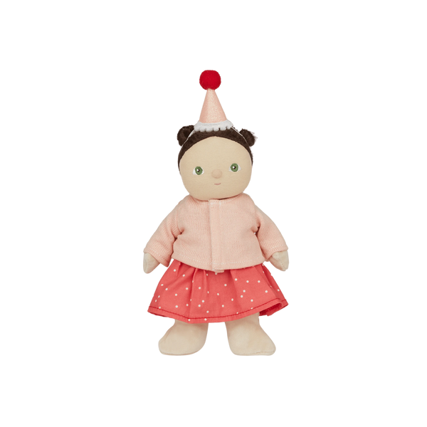 Stuffed doll with a pink outfit and red hat on a white background