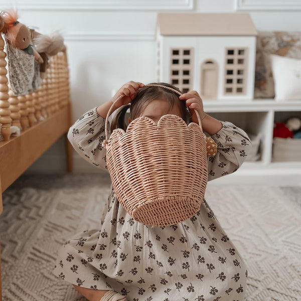 Pink rattan carry basket, perfect for market mornings, nurseries and playspaces. Designed to carry in and out of the home, fill with essentials, toys, dolls, flowers and everything in between.