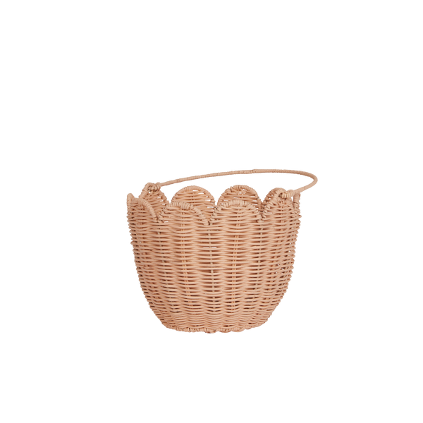 Handwoven pink rattan carry basket, perfect for kids to carry and collect treaures. Fill with dolls and toys, or use as a home décor storage solution in a nursery or bedroom.