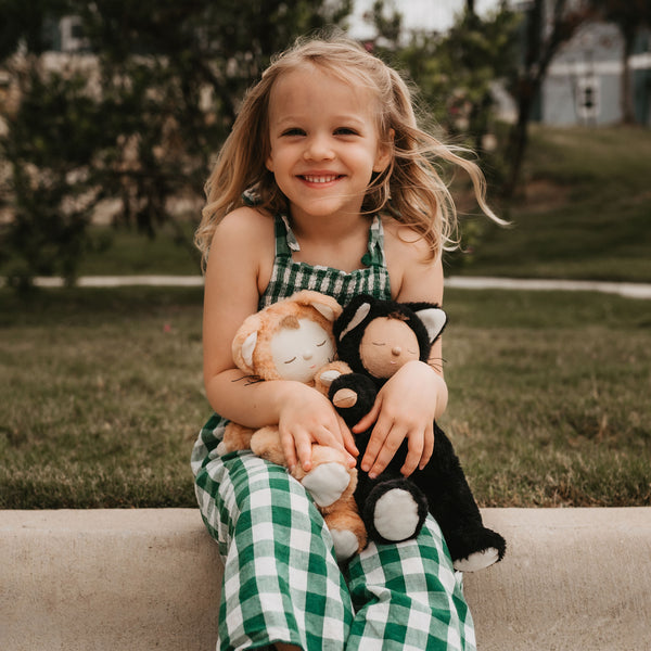 A Black Cat  plush doll from the Cozy Dinkums range, designed for soothing snuggles and imaginative adventures. Soft black cat toy, perfect for all ages bedtime and comfort.