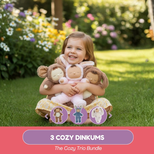 Child holding three plush monkey toys in a garden setting with '3 Cozy Dinkums' branding.