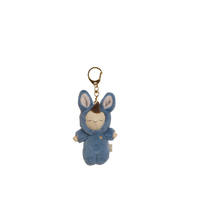 Blue plush keychain with a sleeping baby design on a white background