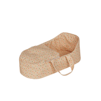 A pink polka dot doll carry cot with soft handles, perfect for little ones to cradle their favorite dolls. Ideal doll bedding, cozy carry cot for toddlers imaginative doll play.