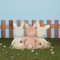 A soft, cuddly plush bunny toy with an ivory-colored coat, perfect for small hands and imaginative play. Perfectly weighted and collectable easter-themed plush toy.