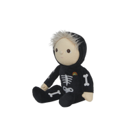 Stuffed toy in a black skeleton outfit with bones and a rainbow on a white background