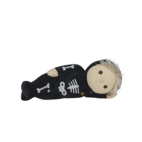 Plush toy resembling a skeleton with a white background