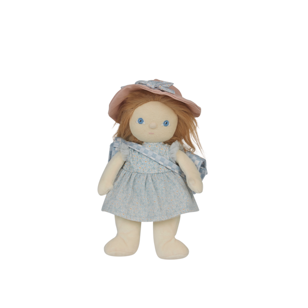 Stuffed doll with a pink hat and blue dress on a white background