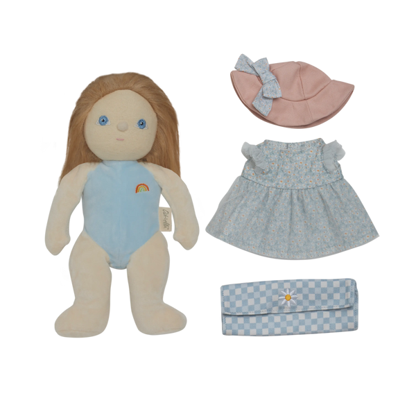 Stuffed doll with blue outfit, pink hat, and checkered bag on a white background