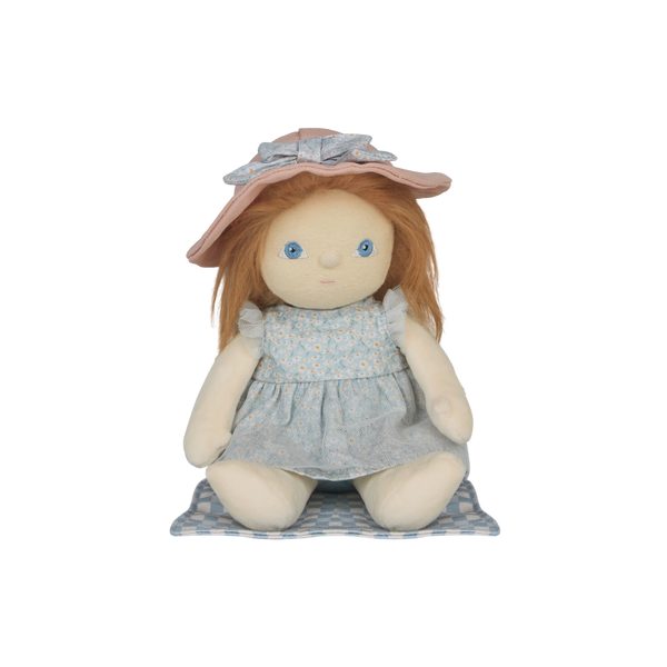 Stuffed doll with red hair, blue eyes, and a pink hat on a white background