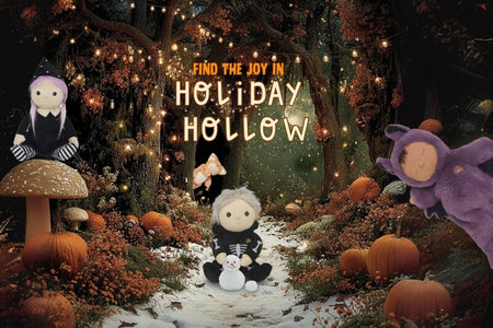 Halloween-themed scene with plush toys and decorations in a forest setting. Olli Ella Au