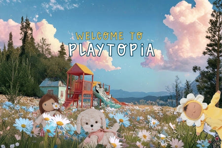 Children's play area with colorful playground equipment and toys in a field of flowers, featuring 'Welcome to Playtopia' text. Olli Ella Au
