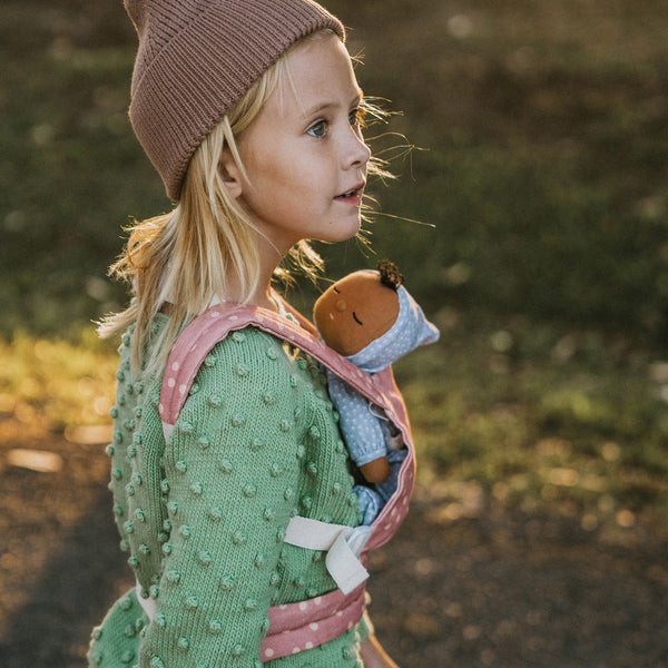 Gender-neutral posable plush doll with purple velvety onsie outfit. Perfectly weighted for cuddles and bedtime. Suitable toy from birth.