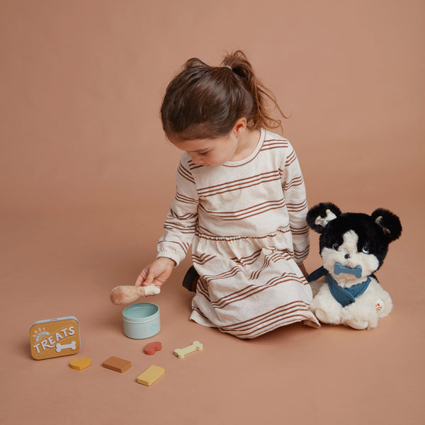 Olli Ella Dinkum Dog Goodie Set - bones and treats accessory pack pictured with Lucky and a child