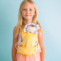 Transport your little one's dolls in style with our Yellow Dinkum Dolls Petal Carrier. Ideal for kids who love imaginative play and flower-themed toys, our Doll carriers are functional and stylish.