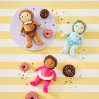 Limited-edition, palm sized, collectable kids plush toy. Sadie Sprinkles is a pink, strawberry  donut weighted plush toy in a velvet onsie, perfect for imaginative kids play.