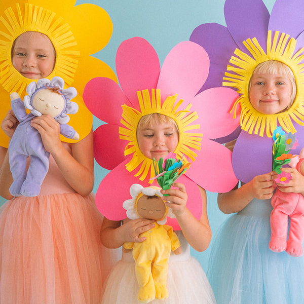 Adorable Dozy Dinkums plush flower doll in Pickle Lavender. Soft and cuddly, perfect for play and snuggling. Made from high-quality, safe materials.