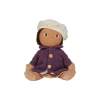 Stuffed toy with a purple outfit and white hat on a white background