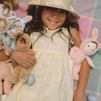 A soft, cuddly plush bunny toy with a pink-colored coat, perfect for small hands and imaginative play. Perfectly weighted and collectable easter-themed plush toy.