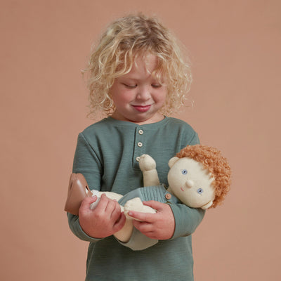 Gender-neutral, posable kids doll with red hair and removable blue outfit. Dress them up and style their hair for hours of interactive kids play.