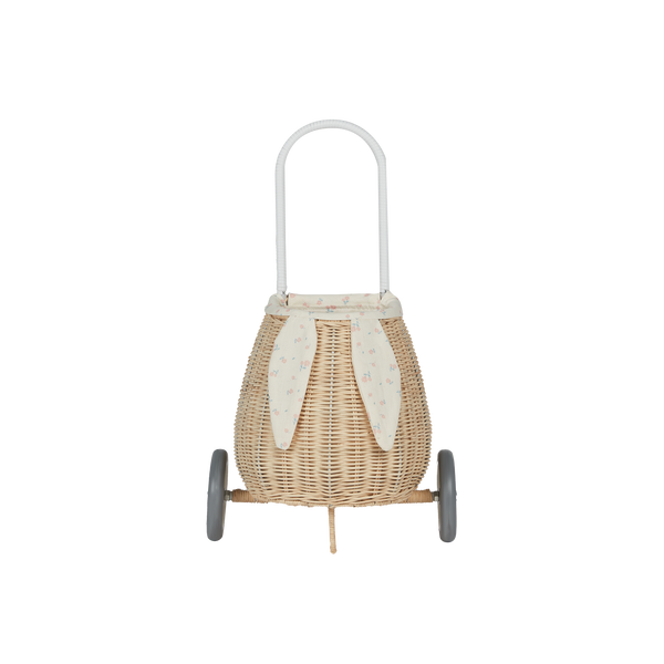 Woven rattan basket on wheels with printed flower lining. Perfectly sized for your kid to transport their favourite toys, dolls and treasures on their adventures. 