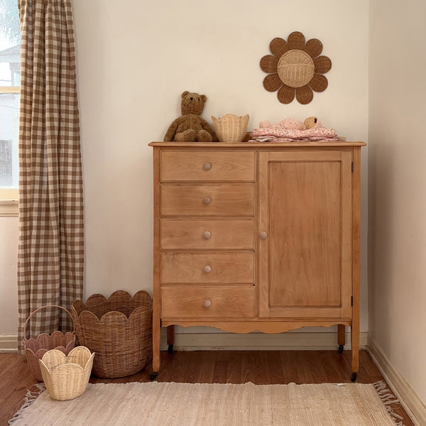 Handwoven rattan daisy shaped wall basket. The perfect décor addition to any nursery or bedroom. Flower Rattan wall storage solution.