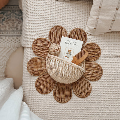 Handwoven rattan daisy shaped wall basket. The perfect décor addition to any nursery or bedroom. Flower Rattan wall storage solution.