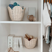 Scalloped edge handwoven rattan basket set. Off-white nesting baskets perfect for storing dolls, toys, baby essentials and everything in between in your nursery or kids bedroom.