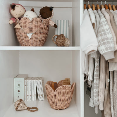 Scalloped edge handwoven rattan basket set. Pink nesting baskets perfect for storing dolls, toys, baby essentials and everything in between in your nursery or kids bedroom.