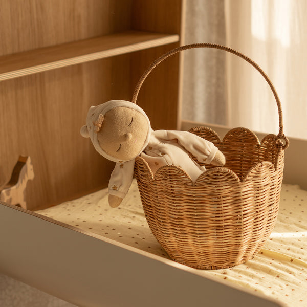 Handwoven brown rattan carry basket, perfect for kids to carry and collect treaures. Fill with dolls and toys, or use as a home décor storage solution in a nursery or bedroom.