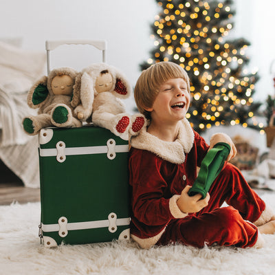 Olli Ella See-Ya Suitcase Forest Green pictured with Christmas accessories