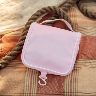 Compact, durable kids pink toiletry bag by Olli Ella. Perfect for toiletries and travel essentials. Ideal for organized packing, made from eco-friendly materials.