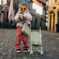 Olli Ella dusty green doll pram for kids toys. For use with our posable dinkum dolls and matching changing bag and mat for imaginative doll play.