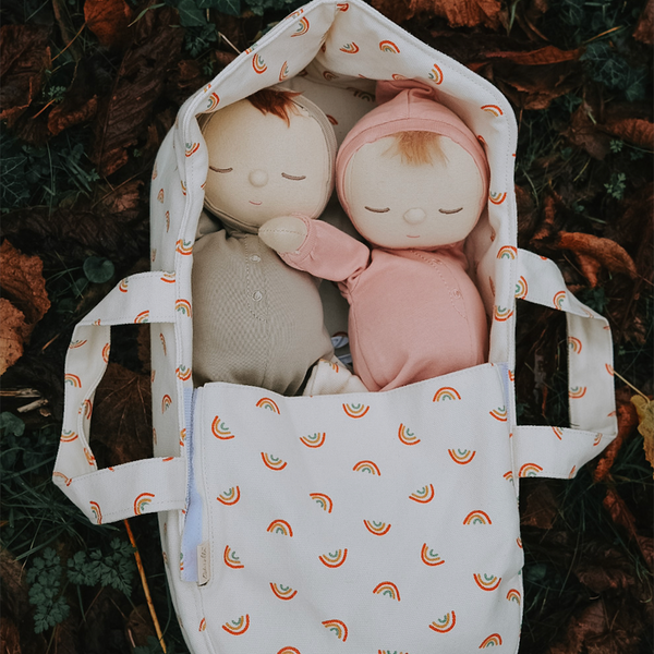 Durable cotton canvas doll carry cot with gender-neutral rainbow print.