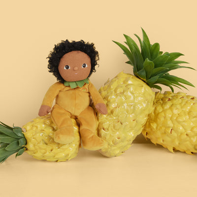 A limited-edition palm-sized plush toy, perfectly weighted in all the right places, and outfitted in a snuggly plush velvety pineapple suit.