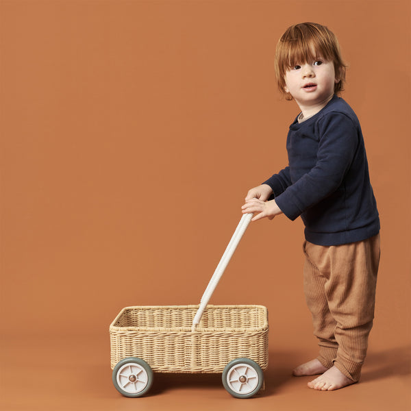 Handwoven rattan wahon on wheels for kids. The Wamble Walker is a fabulous companion as your child grows and develops.