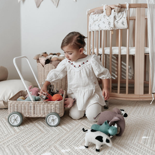 Handwoven rattan wahon on wheels for kids. The Wamble Walker is a fabulous companion as your child grows and develops.