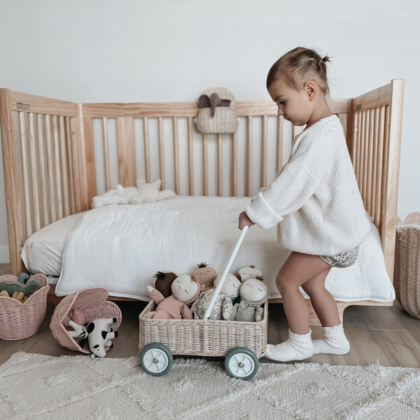 Handwoven rattan wahon on wheels for kids. The Wamble Walker is a fabulous companion as your child grows and develops.